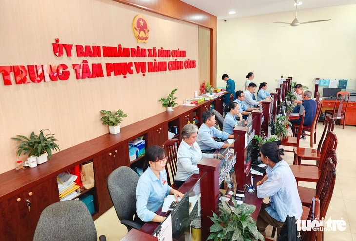 Người dân 'hẹn giờ' làm thủ tục hành chính ở Bình Chánh, không cần bấm số chờ - Ảnh 1.