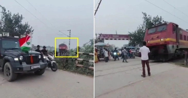 Người dân liên tục băng qua ngay trước mũi tàu, nhân viên đường sắt phải xuống trước mũi tàu điều tiết - Ảnh 1.