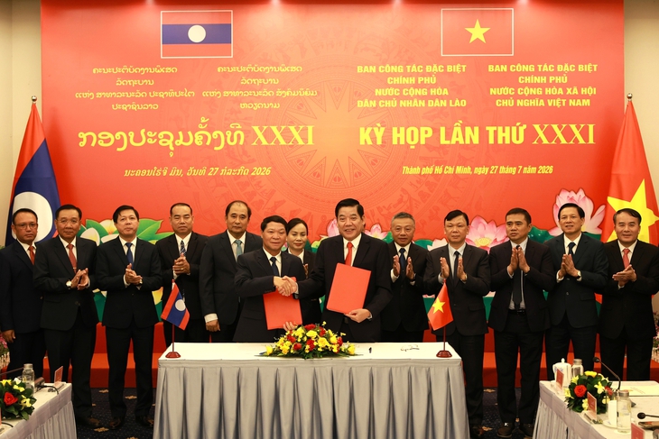 Lào đồng hành tìm kiếm, quy tập hài cốt liệt sĩ Việt Nam hy sinh trên nước bạn hồi hương - Ảnh 1.