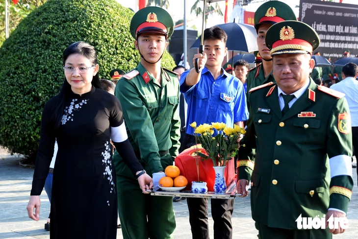Đồng Nai an táng 29 hài cốt liệt sĩ được quy tập trong chiến dịch 500 ngày đêm - Ảnh 7.