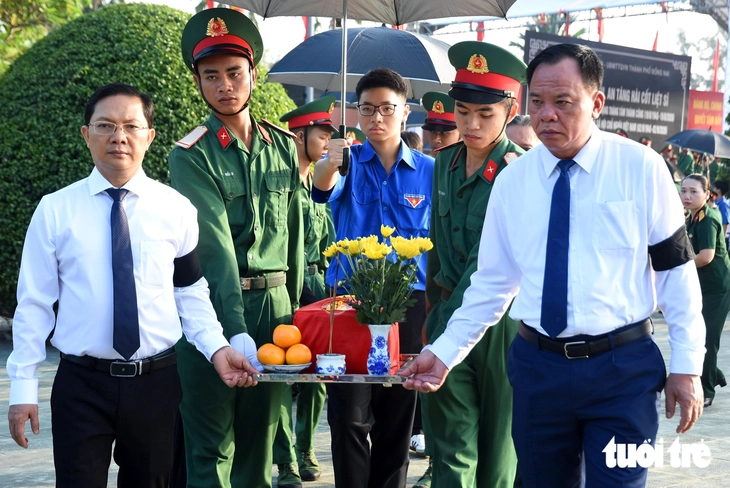 Đồng Nai an táng 29 hài cốt liệt sĩ được quy tập trong chiến dịch 500 ngày đêm - Ảnh 11.