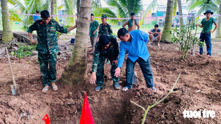 Đội K91 tìm thấy 42 bộ hài cốt liệt sĩ trong vườn trồng dừa - Ảnh 1.