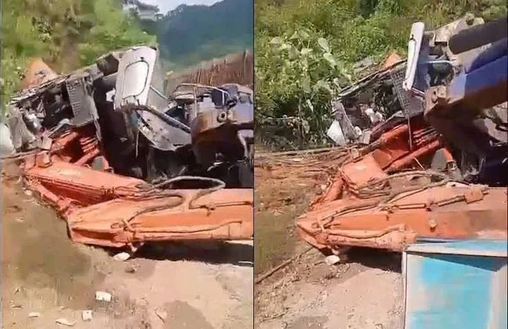 Lật xe tải chở máy múc đè chết hai vợ chồng đi xe máy - Ảnh 1.