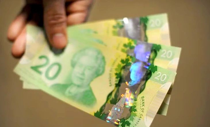 Tờ 20 đô Canada mới dùng công nghệ bảo mật chưa từng có, dải màu tím bí ẩn - Ảnh 1.