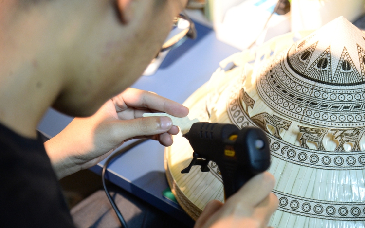 Vietnamese engineering graduate gives traditional conical hats a modern cultural twist