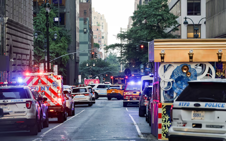 Gunman kills four, including police officer, in Manhattan skyscraper, then takes own life