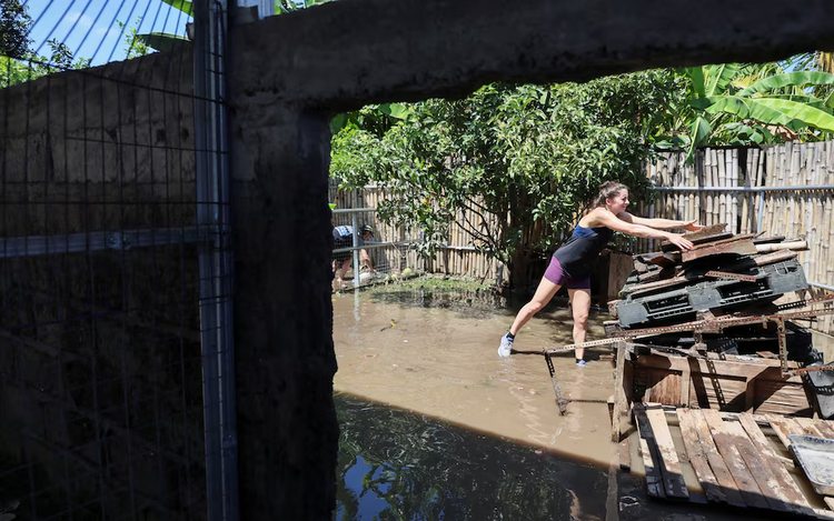 Waters recede in Bali after floods kill 16 people, with two still missing