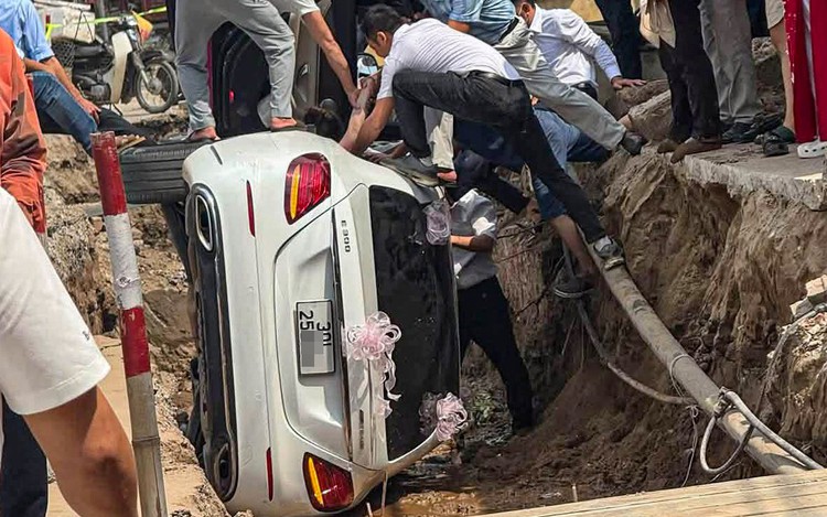Vietnamese bride rescued after Mercedes wedding car flips into road construction trench