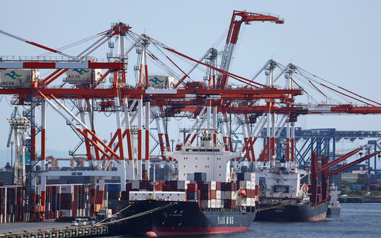 Japan's exports surge on chips demand, imports hit record on oil costs