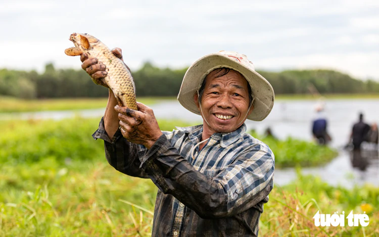In Vietnam, villagers enjoy one-day fishing festival after preserving wetland year-round