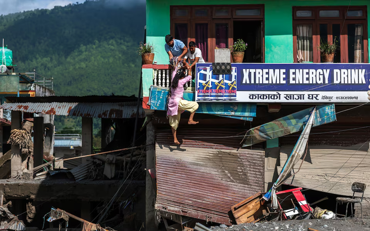 Rescuers battle floods and debris as Himalayan disaster death toll nears 800