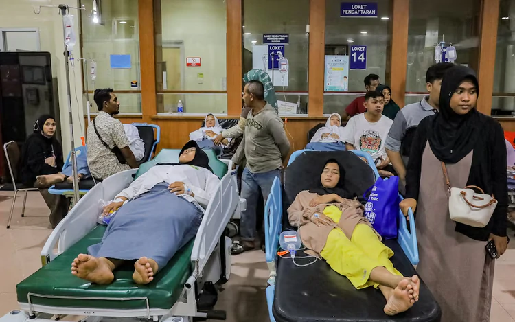 Indonesian officials suspect food poisoning from free school meal after more than 500 fall ill