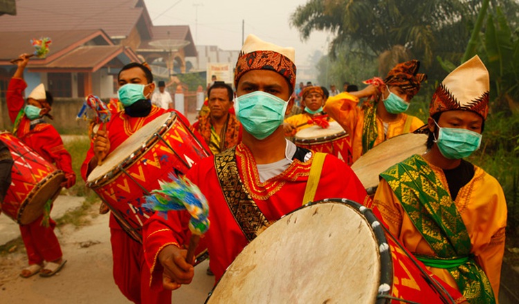 Muslim students wearing masks celebrate Khatam