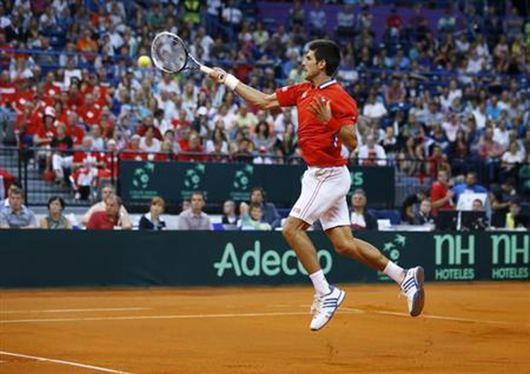 Djokovic hauls Serbia level against Canada