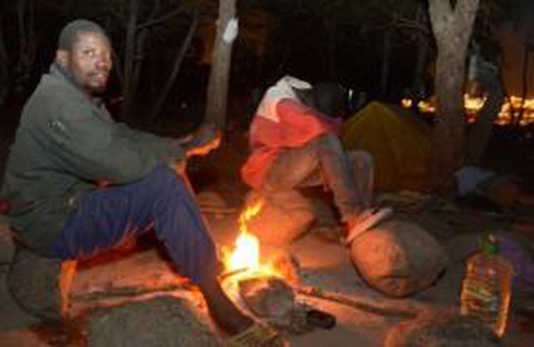 Scores of migrants storm through Spanish border fence