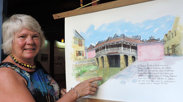 Exhibit on Vietnam’s Hoi An old town by UK artist running