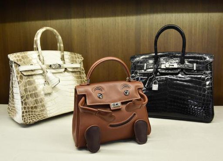 LVMH, Hermes call truce in battle for luxury brands