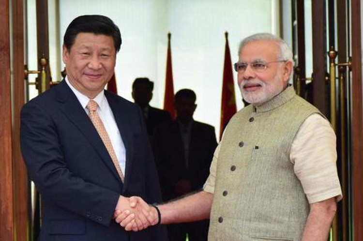 China's Xi makes maiden India visit, seeking to reset ties