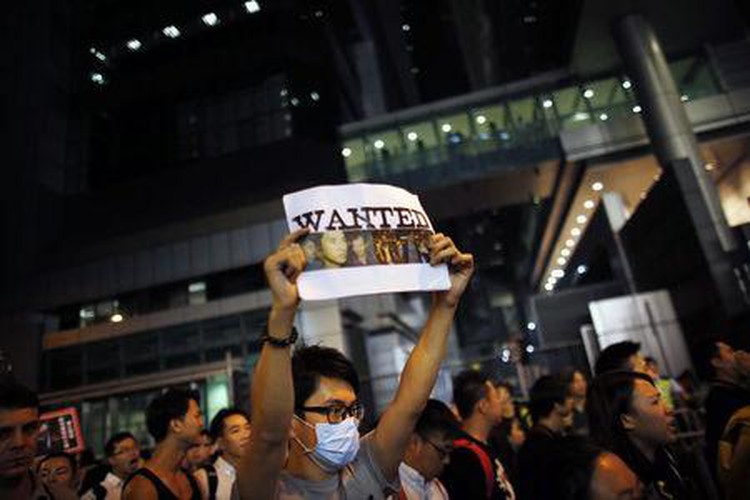 China asks foreign media to report Hong Kong unrest "objectively"