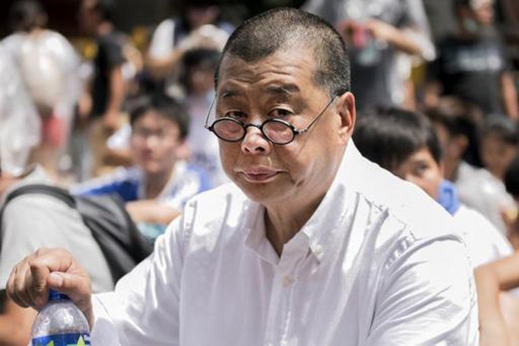 Attackers throw rotten animal organs at Hong Kong media tycoon