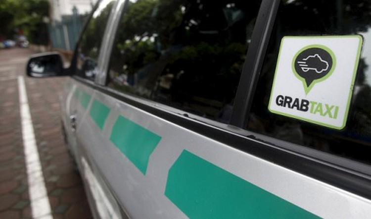 Ride-sharing apps vie to replace private car ownership in Vietnam
