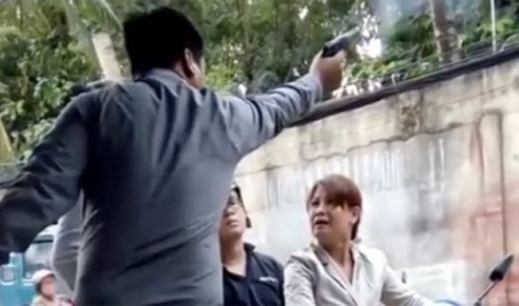 Alleged security firm director seen firing gun during quarrel with woman in Saigon
