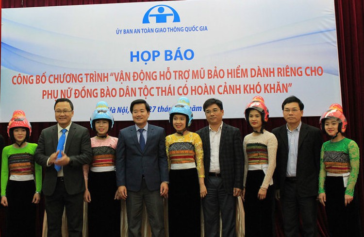 Ethnic Vietnamese women with high buns get tailored helmets