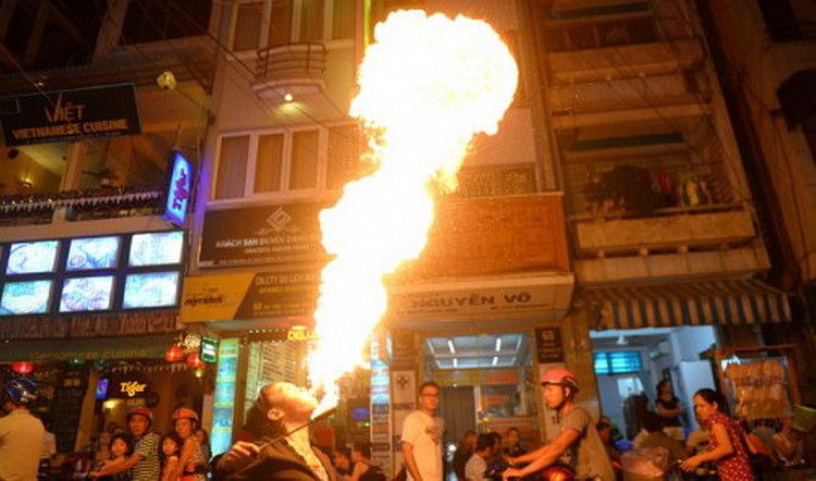 Vietnamese women, teen girls breathe fire for living at expense of own health