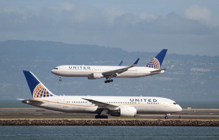 United Airlines under fire after passenger dragged from plane; officer put on leave