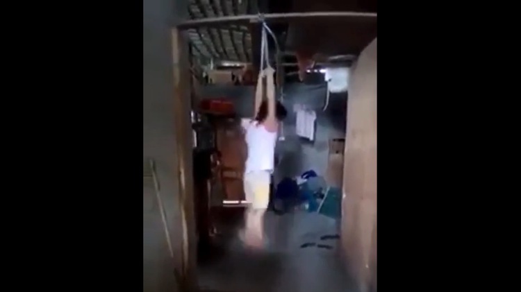 Vietnamese foster mother ties child’s hands, suspends from beam over stolen milk box