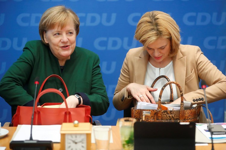 German government talks likely a month away, Merkel ally says