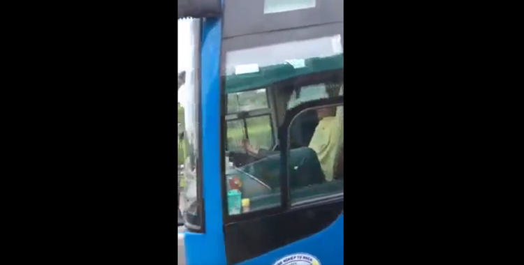 Vietnamese driver filmed driving with leg on expressway suspended from work
