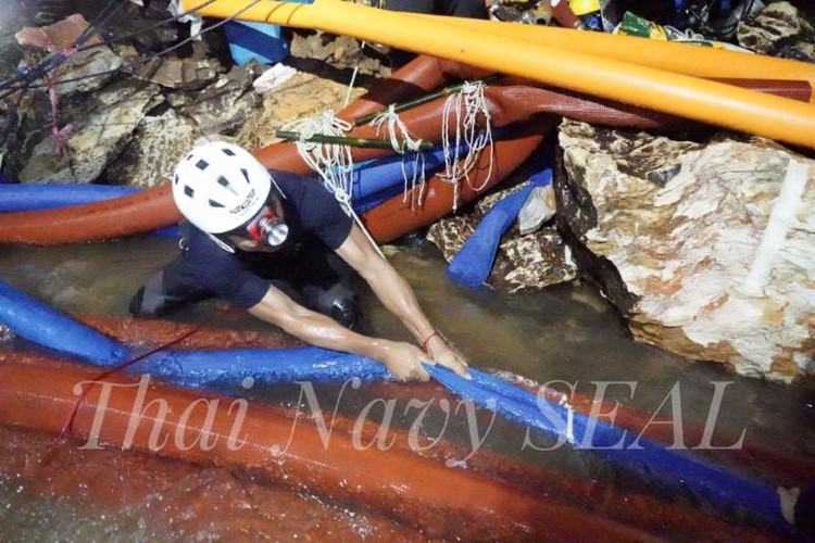 Rescuers ponder how to extract boys from flooded Thai cave as more rain due