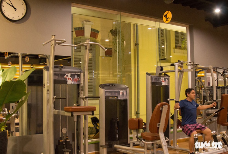 Young Saigonese hit the gym after dark to relieve stress