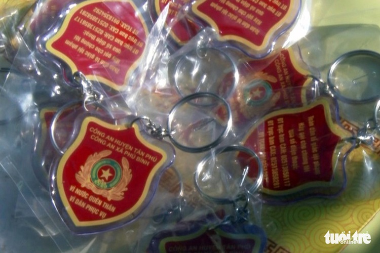 Vietnamese police give locals free emergency call keychains for better crime control