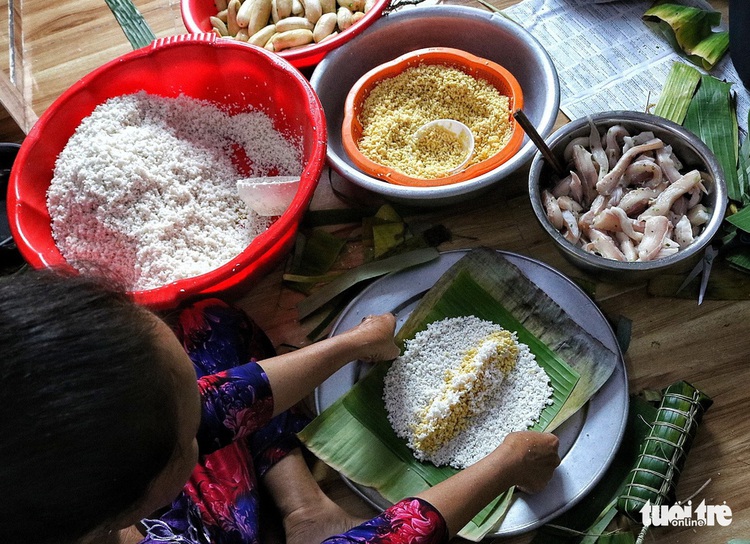 Saigon family preserves Tet tradition with homemade ‘banh tet’