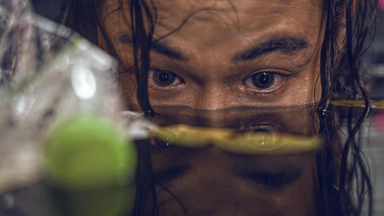 Man ‘drowns in garbage’ in haunting photo album by Vietnamese make-up artist