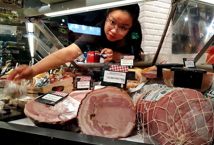 Vietnamese shop for foreign delicacies for Tet