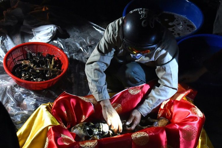 Goodbye, again: Vietnam's reburials send souls on final journey