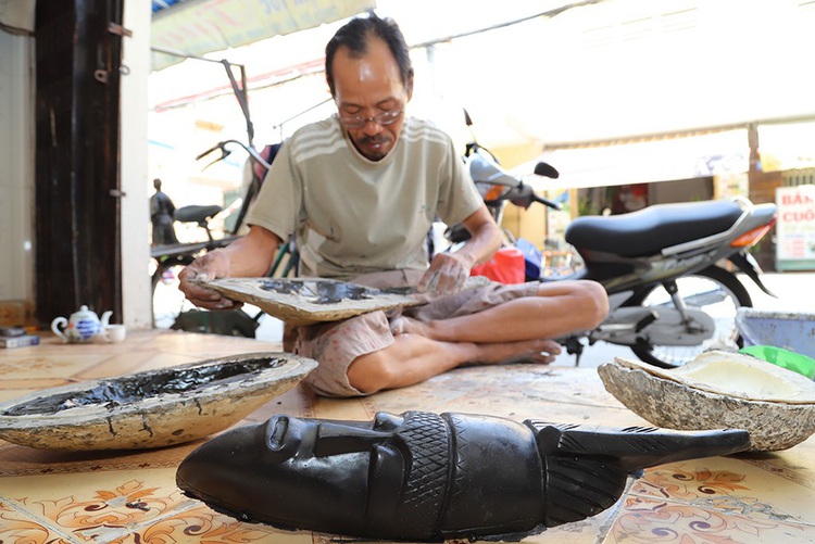 Vietnamese man devotes life to making traditional masks despite their waning popularity