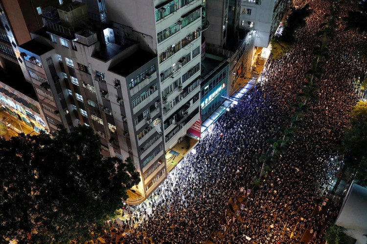 Hong Kong leader apologizes as protesters press demands for her to quit