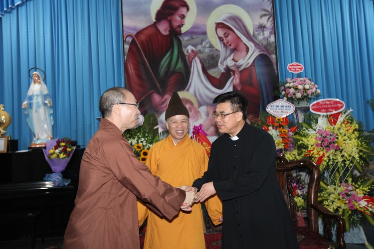 Senior Buddhist monks visit churches on Christmas Eve in Vietnam