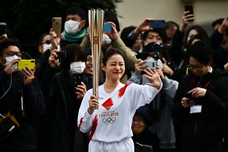 Tokyo holds Olympic torch rehearsal as spectre of virus looms