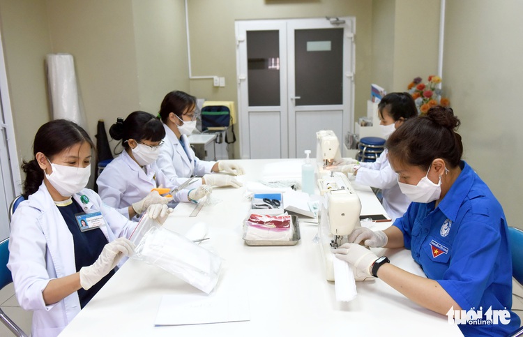 Medical staff make DIY face masks as COVID-19 triggers shortage in Vietnam