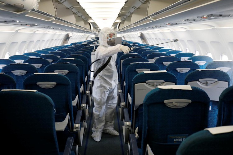 Vietnam asks police to aid search for five arriving on plane with COVID-19 patient