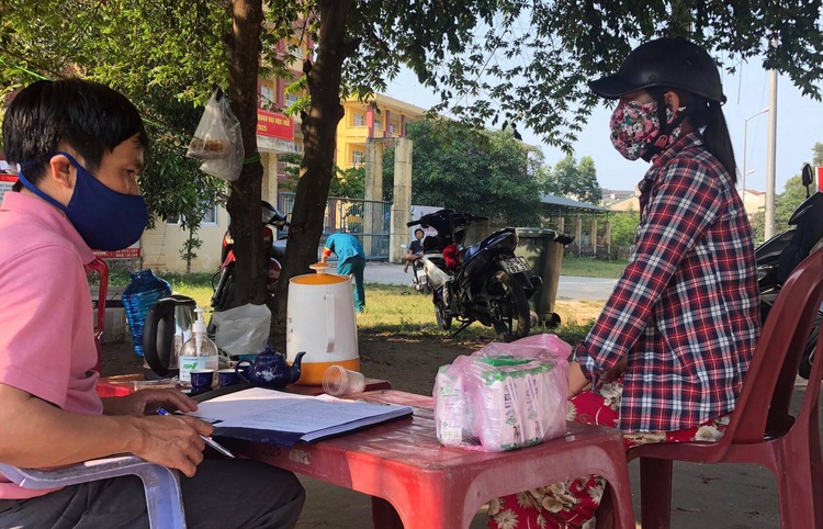 Vietnam woman caught trying to send alcohol disguised in milk cartons to quarantine camp
