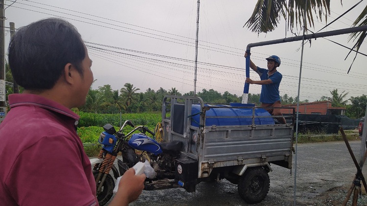 Farmer’s reservoir soothes thirst in Vietnam’s salinity-hit Mekong Delta