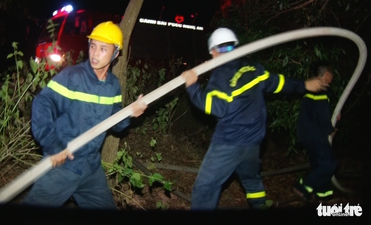 Firefighters work past midnight battling forest fires in north-central Vietnam
