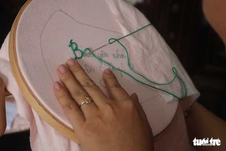 Amateur embroidery artists turn masks into fashion items amid coronavirus pandemic in Vietnam