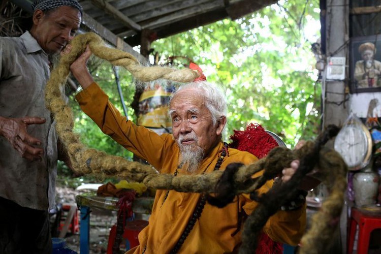 Vietnamese man with five-metre hair says lifelong grow-out is divine calling